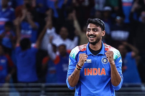 India's Axar Patel celebrates after taking the wicket of New Zealand's Kane Williamson during the ICC Champions Trophy ODI cricket match between New Zealand and India at the Dubai International Stadium in Dubai on March 2, 2025.