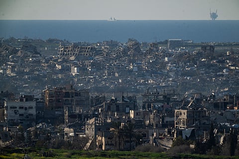 Buildings destroyed during the Israeli air and ground offensive stand in the Gaza Strip are seen from southern Israel, Sunday, March 2, 2025.