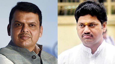 Maharashtra Chief Minister Devendra Fadnavis (L), Dhananjay Munde