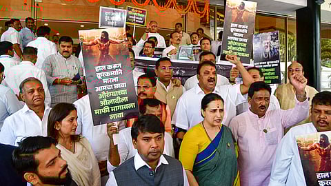 Members of the ruling Mahayuti stage a protest against Samajwadi Party MLA Abu Asim Azmi over his remarks about Mughal emperor Aurangzeb, during the Budget session of Maharashtra Assembly, in Mumbai, Tuesday, March 4, 2025.