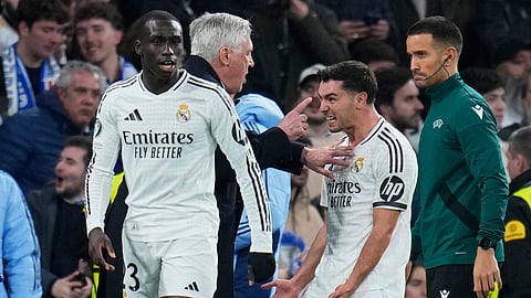 Real Madrid's Brahim Diaz, right, celebrates with his head coach Carlo Ancelotti after scoring his side's second goal during the Champions League round of 16 first leg soccer match between Real Madrid and Atletico Madrid at the Bernebeu stadium on Tuesday, March 4, 2025.