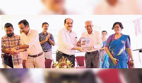 Industries Principal Secretary A P M Mohammed Hanish releasing ‘Kerala’s Geological Sentinel: Glimpses of Activities of Geological Survey of India’ by handing it over to M M Nair, Dy DG (retd.), GSI