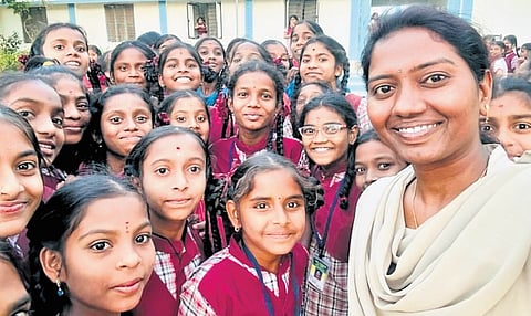 A constable meets girl students in Nirmal district on Wednesday