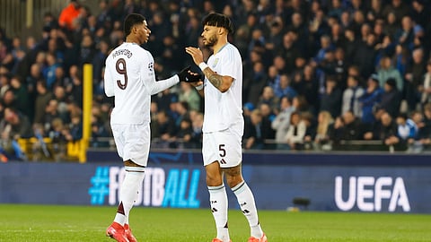 Aston Villa's Marcus Rashford, left, and Aston Villa's Tyrone Mings at the start of the Champions League round of 16 first leg soccer match between Club Brugge and Aston Villa on Tuesday, March 4, 2025.