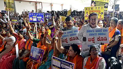 BJP leaders and workers protest against the state government alleging the government has misused SCSP-TSP Money.