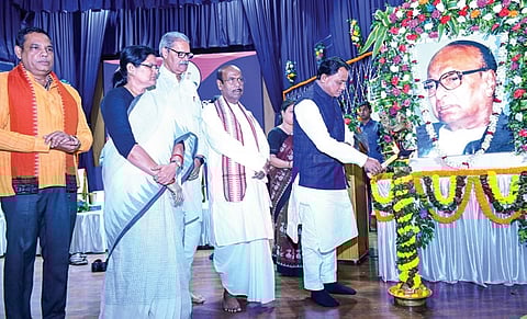 CM Mohan Majhi, dy CMs KV Singh Deo and Pravati Parida paying tributes to Biju Patnaik on his birth anniversary at the state-level function on Wednesday