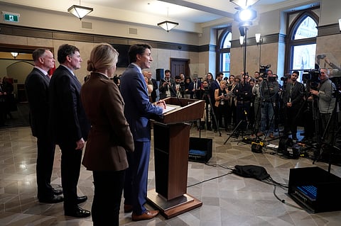 Prime Minister Justin Trudeau holds a news conference on imposed U.S. tariffs as Foreign Affairs Minister Melanie Joly, Finance Minister Dominic LeBlanc and Public Safety Minister David McGuinty look on in Ottawa on Tuesday, March 4, 2025.