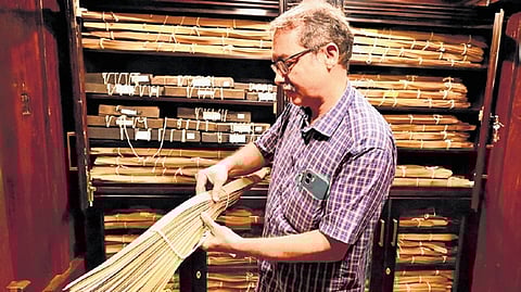 Hari C T, the administrator of the
proposed Sevadhi museum, displays the palm-leaf manuscripts