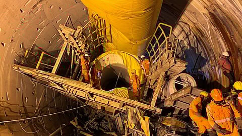 The last parts of the Tunnel Boring Machine (TBM) would be cut using a gas cutter and would be brought out of the tunnel in a loco train.