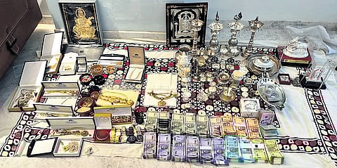 Household articles, cash, documents and other items seized by the Lokayukta police during a raid on a government official