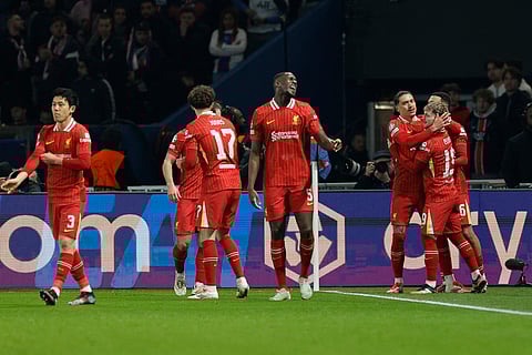 Liverpool Harvey Elliott (R) celebrates with teammates after scoring Liverpool's first goal during the UEFA Champions League Round of 16 first leg football match between PSG and Liverpool on March 5, 2025.