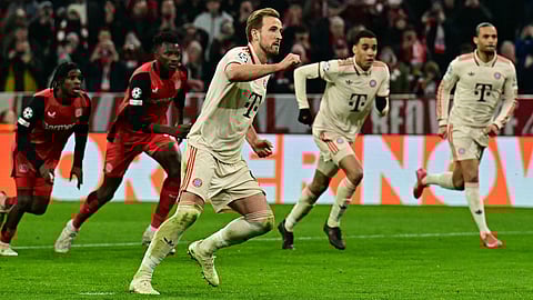 Bayern Munich's English forward Harry Kane celebrates scoring the 3-0 goal from the penalty spot with his teammates during the UEFA Champions League last 16, first-leg, football match FC Bayern Munich vs Bayer Leverkusen on March 5, 2025 in Munich.