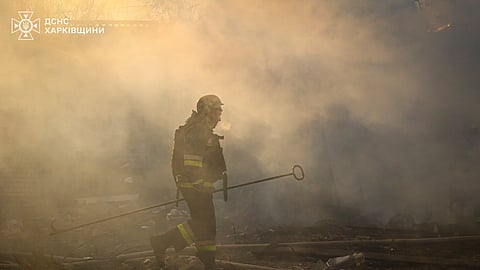 In this photo provided by the Ukrainian Emergency Service, firefighters put out the fire following a Russian rocket attack in Kharkiv, Ukraine, Friday, March 7, 2025.