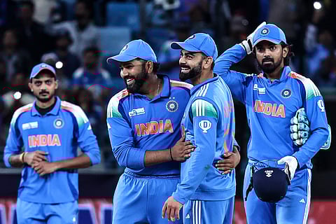 India's captain Rohit Sharma (2L) and his teammate Virat Kohli (2R) celebrate their team's win in the ICC Champions Trophy ODI cricket match between New Zealand and India at the Dubai International Stadium in Dubai on March 2, 2025.