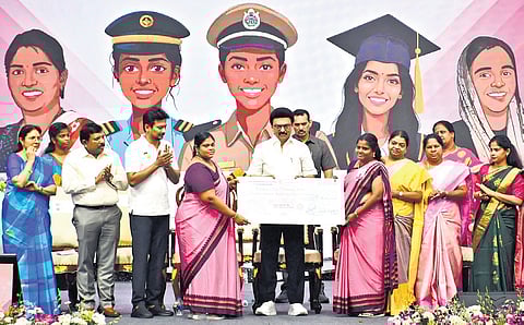 CM MK Stalin handing over aid to self-help groups at Jawaharlal Nehru Stadium in Chennai on Saturday