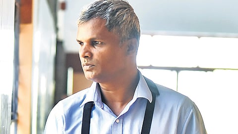 Miranda Tomkinson, a person with hearing and visual disabilities, enters the UGC NET examination hall at MGR Janaki College in Chennai.