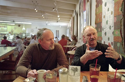Gene Hackman, right, and long-time friend Daniel Lenihan, discusses their new book, "Wake of the Perdido Star", on Nov 19, 1999, in Cloudclift Bakery, the cafe where they first dreamed up their adventure story, in Santa Fe, N.M.