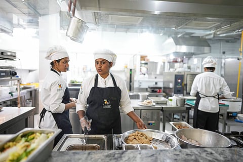 Cook Malithi Prabhani, second left, and her colleagues prepare lunch for guests at the Amba Yaalu resort in the Kandalama locality in Dambulla, Sri Lanka, Friday, Feb. 21, 2025.