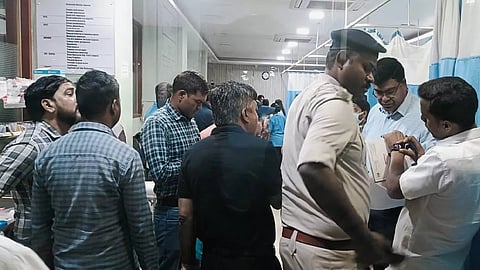 Police officials at the hospital after NTPC DGM Kumar Gaurav was shot in Jharkhand.