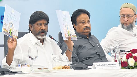 Deputy Minister Mallu Bhatti Vikramarka, along with AIMIM chief Asaduddin Owaisi and other MPs, at Praja Bhavan in Hyderabad on Saturday