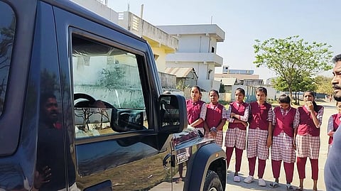 Class 10 students of Dhanora (B) Government School obstruct the vehicle of the headmaster in Boath mandal on Friday.