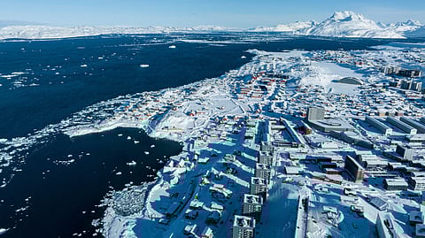 Houses covered by snow are seen in Nuuk, Greenland, Wednesday, March 5, 2025.