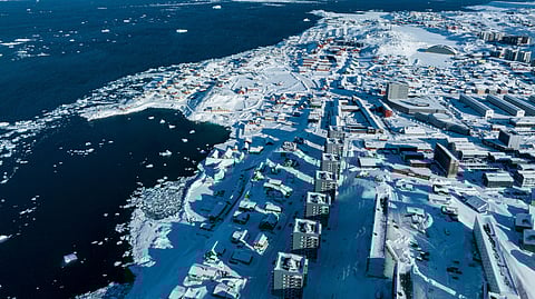 Houses covered by snow are seen in Nuuk, Greenland, Wednesday, March 5, 2025.