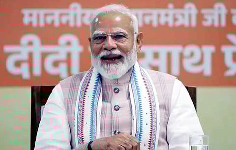 Prime Minister Narendra Modi interacts with 'Lakhpati Didis', in Navsari, Gujarat.