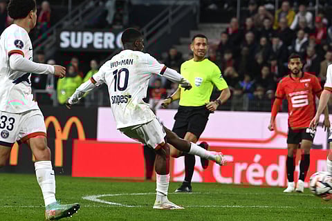 PSG's Ousmane Dembele shoots to score his second goal during the French L1 football match between Stade Rennais FC and PSG at Roazhon Park Stadium in Rennes, western France on March 8, 2025.