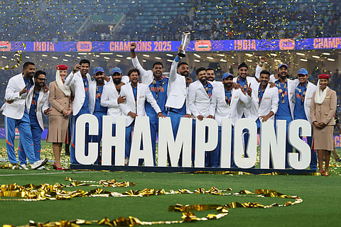 India spinner Varun Chakravarthy lifts the trophy with the team on Sunday