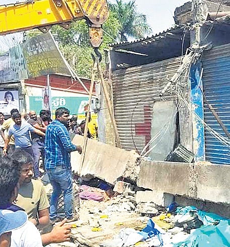 Rescue work is underway at the building collapse site in front of the KSRTC bus stand in Belur on Sunday