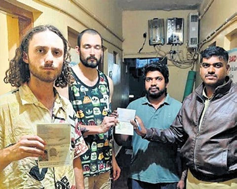 Police assure the safety of foreign tourists at a homestay in Hampi