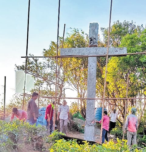 Revenue officials demolish the cross erected at Parunthumpara in Idukki