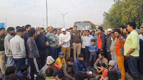People during a protest by residents of Ghazipur on Akshardham-Ghaziabad road against the alleged murder of a young man, in Delhi, Monday, March 10, 2025.