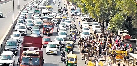 Vehicles stuck in traffic during protest by Ghazipur residents on NH-24