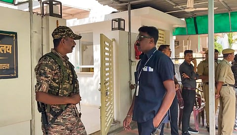 Security personnel stand guard during raids by the Enforcement Directorate (ED) on premises linked to Chaitanya Baghel, son of former Chhattisgarh Chief Minister and Congress leader Bhupesh Baghel, in connection with an alleged liquor scam, in Bhilai, Monday, March 10, 2025.