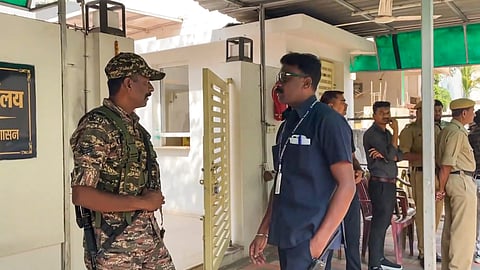 Security personnel stand guard during raids by the Enforcement Directorate (ED) on premises linked to Chaitanya Baghel, son of former Chhattisgarh Chief Minister and Congress leader Bhupesh Baghel, in connection with an alleged liquor scam, in Bhilai, Monday, March 10, 2025.