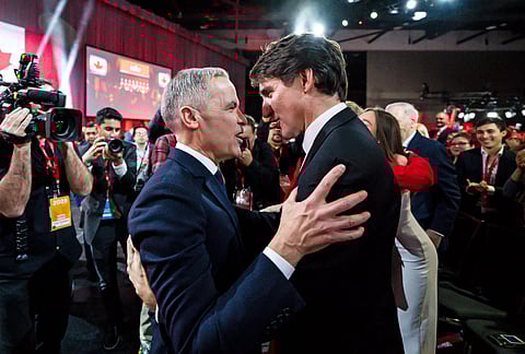 Mark Carney, Leader of the Liberal Party of Canada, embraces Prime Minister Justin Trudeau after being announced the winner at the Liberal leadership Event in Ottawa, Ontario, Sunday, March 9, 2025.