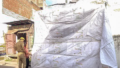 The Shahi Jama Masjid being covered in tarpaulin as prevention against possible holi colour ahead of the celebration, in Sambhal, Uttar Pradesh, Wednesday, March 12, 2025.