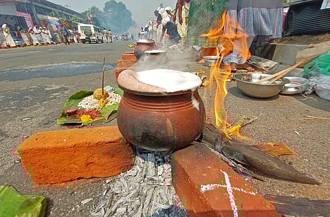 Devotees offering Attukal pongala at Thampanoor in connection with the Pongala festival