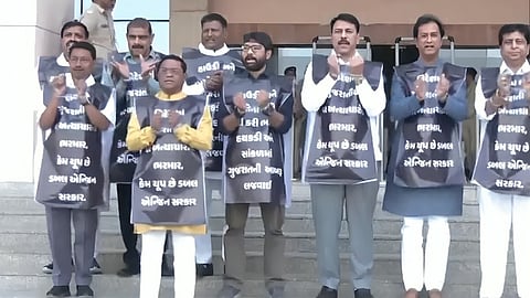 Congress MLAs tied themselves with iron chains to protest against MP's "increased" loan.