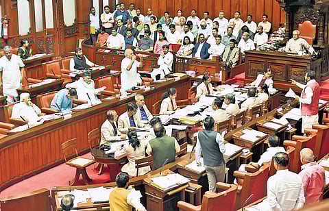 Leader of Opposition Chalavadi Narayanaswamy argues with ministers in the Council, as Chairman Basavaraj Horatti looks on, on Thursday