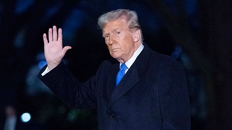 US President Donald Trump waves to the media as he walks on South Lawn of the White House, in Washington, Sunday, March 9, 2025.