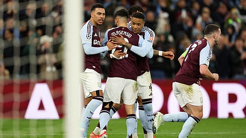 Aston Villa's Spanish midfielder #21, Marco Asensio (C) celebrates with teammates after scoring his team third goal during the last 16 second leg UEFA Champions League football match between Aston Villa and Club Brugge at Villa Park in Birmingham, central England on March 12, 2025.