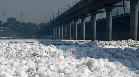 In this photo from Oct. 19, 2024, toxic foam floats on the polluted Yamuna River at Kalindi Kunj, New Delhi.