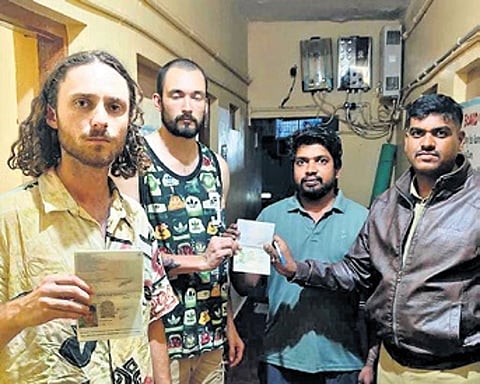 Police assure the safety of foreign tourists at a homestay at Hampi