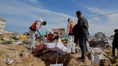 The bodies of Palestinians killed during the Israel-Hamas war and were buried in a mass grave at Shifa Hospital yard are exhumed for identification and reburial in Gaza City's official cemeteries, on Thursday, March 13, 2025.