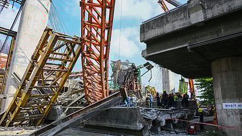Thai rescue workers work the scene after an elevated road being built collapsed in Bangkok, Thailand, Saturday, March 15, 2025.