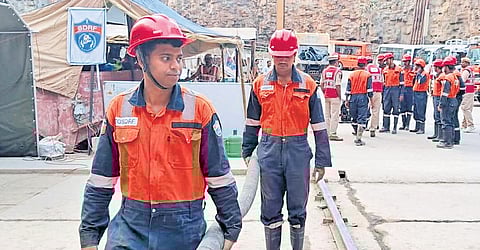 Workers are seen busy at the SLBC tunnel collapse site on Sunday.
