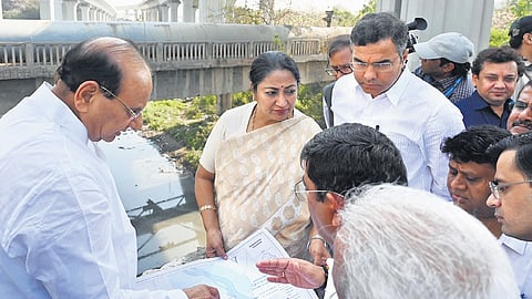 CM Rekha Gupta, LG VK Saxena and minister Parvesh Verma during inspection of ongoing work at Sunheri Pul and Barapulla drain on Sunday.